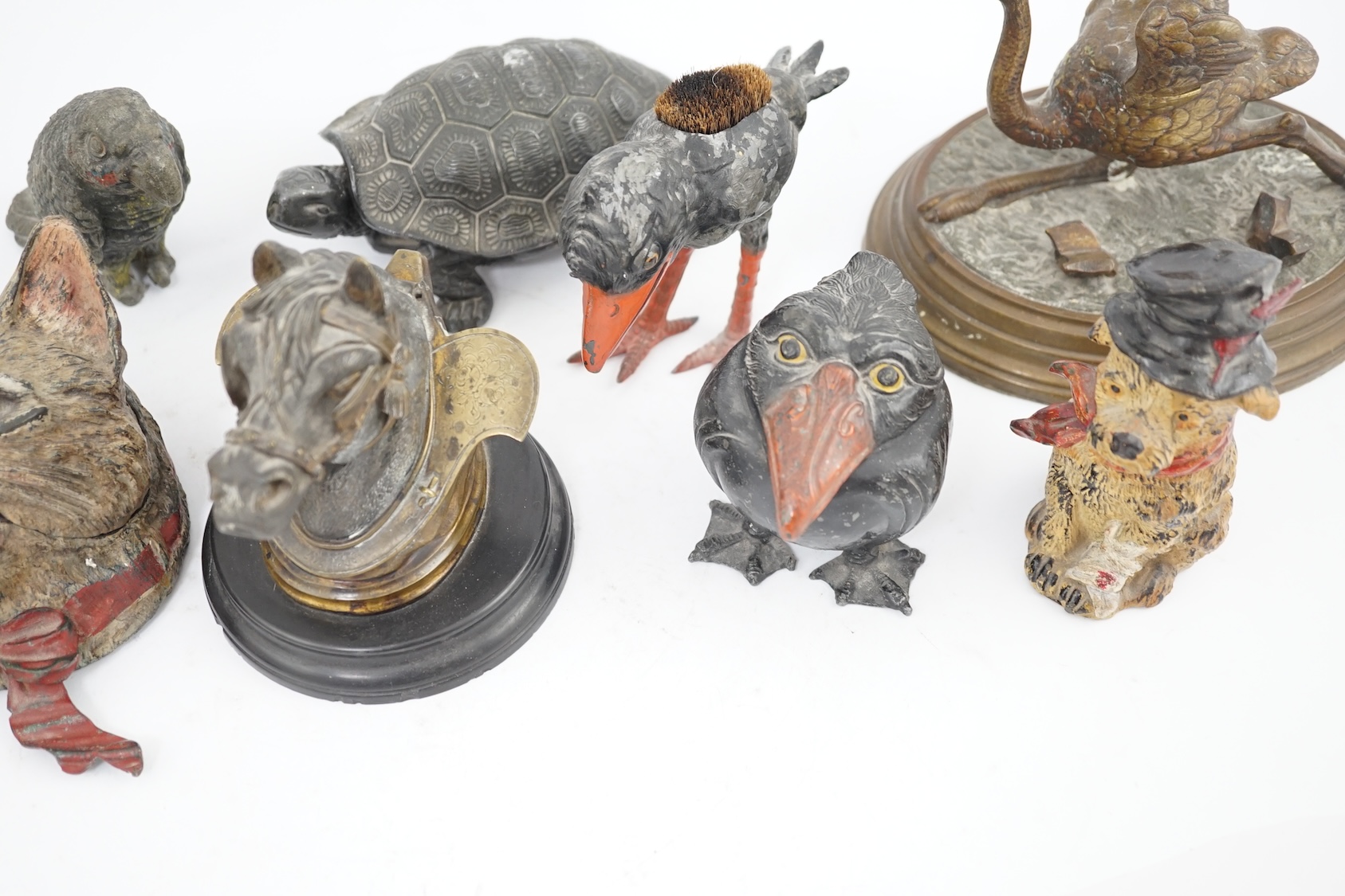 A collection of nine 19th and 20th century novelty animal bronze and metal ink wells, including a Martin Brothers-style ‘Wally’ inkwell. Condition - minor chips due to use and age